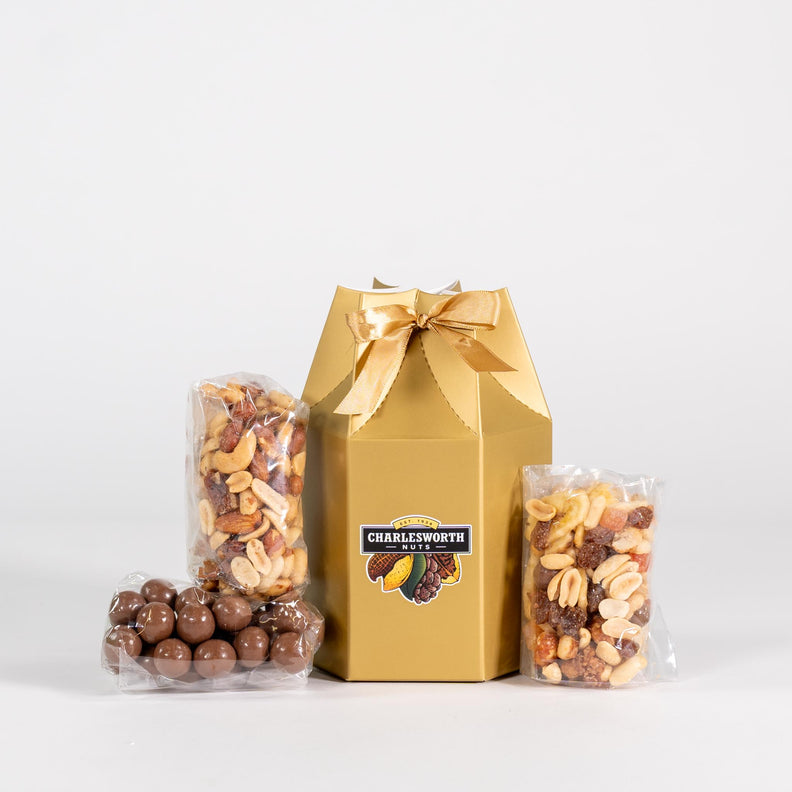 Small gift box filled with salted nuts and chocolate apricots/