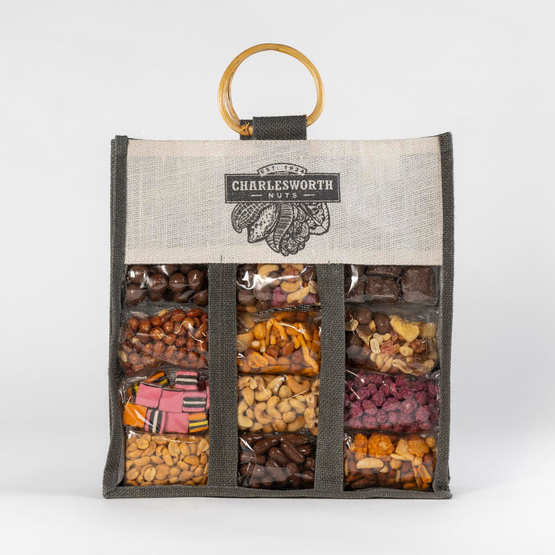 Beautifully presented Christmas Gift Bag filled with chocolates, sugar coated peanuts, licorice, beer nuts, chocolates, and much more