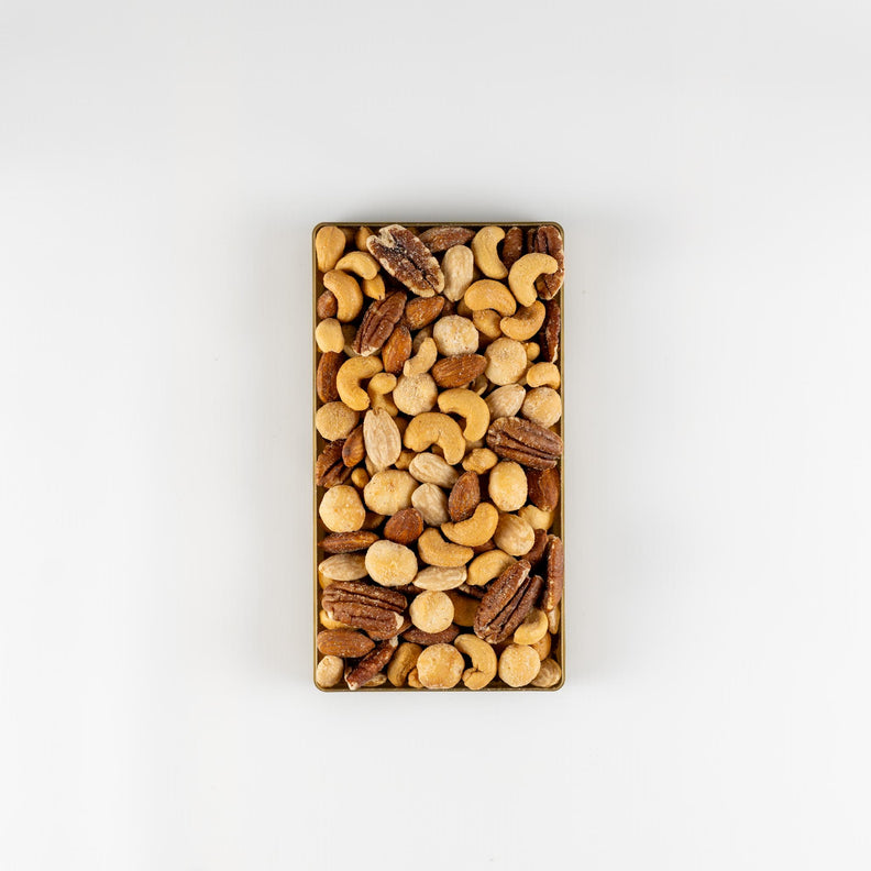 Christmas gift pack filled with salted macadamias, salted cashews, salted peanuts, salted walnuts and salted pecans.