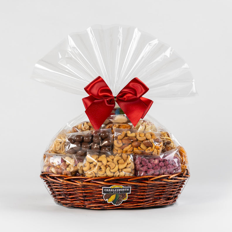 Christmas Gift Basket full of nuts and chocolates and adorned with a red bow