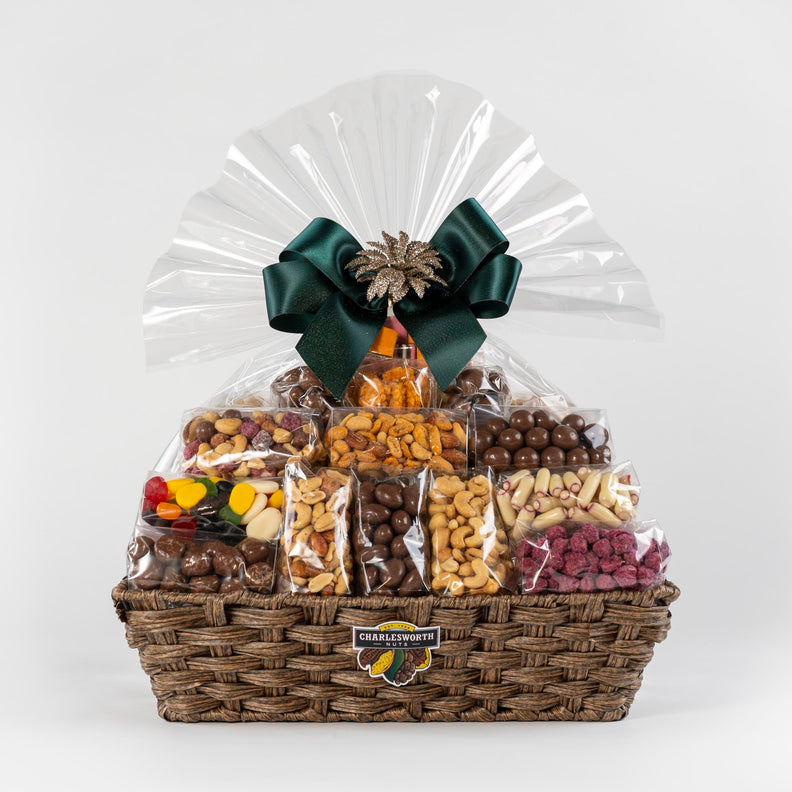 Christmas Gift Basket beautifully presented in a reusable basket and green ribbon. It includes 34 individually Charlesworth products: Apricot fruit pieces, beer nuts, chocolate apricots, glazed peanuts, salted cashews, sugared peanuts and much more.