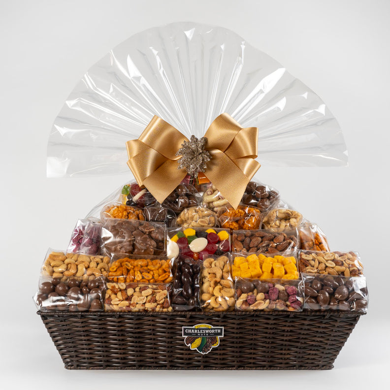 Christmas Gift Basket beautifully presented in a reusable basket. Filled with 52 Charlesworth products: Apricots Fruit pieces, BBQ puff rice crackers, choco lolly chocs, chocolate almonds, chocolate almonds, chocolate honeycomb, glazed almonds, glazed peanuts and much more,